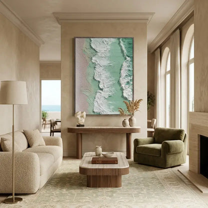 Modern living room with a large abstract painting on the wall, beige sofa, and green armchair.