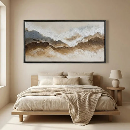 Beige bedroom with a bed, lamp, and abstract wall art