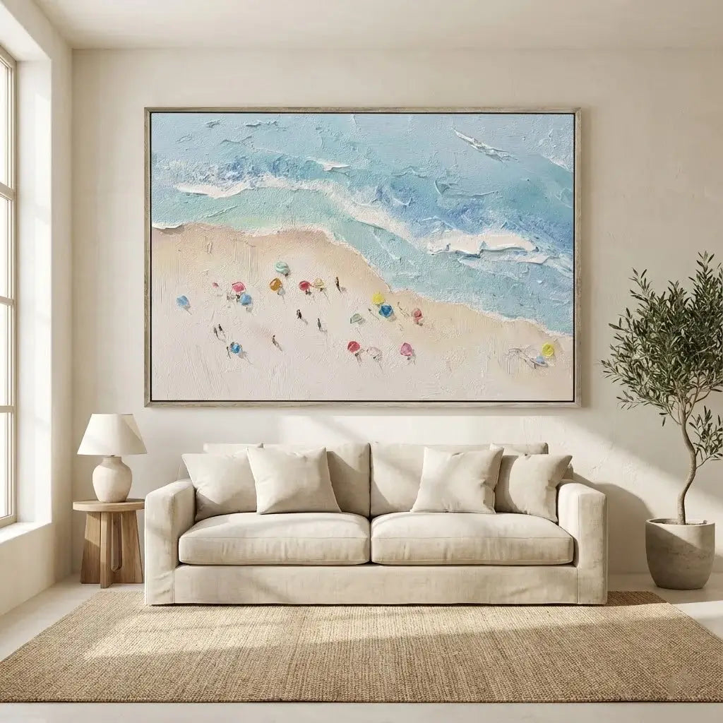 Living room with a beige sofa, framed abstract art, and a plant.