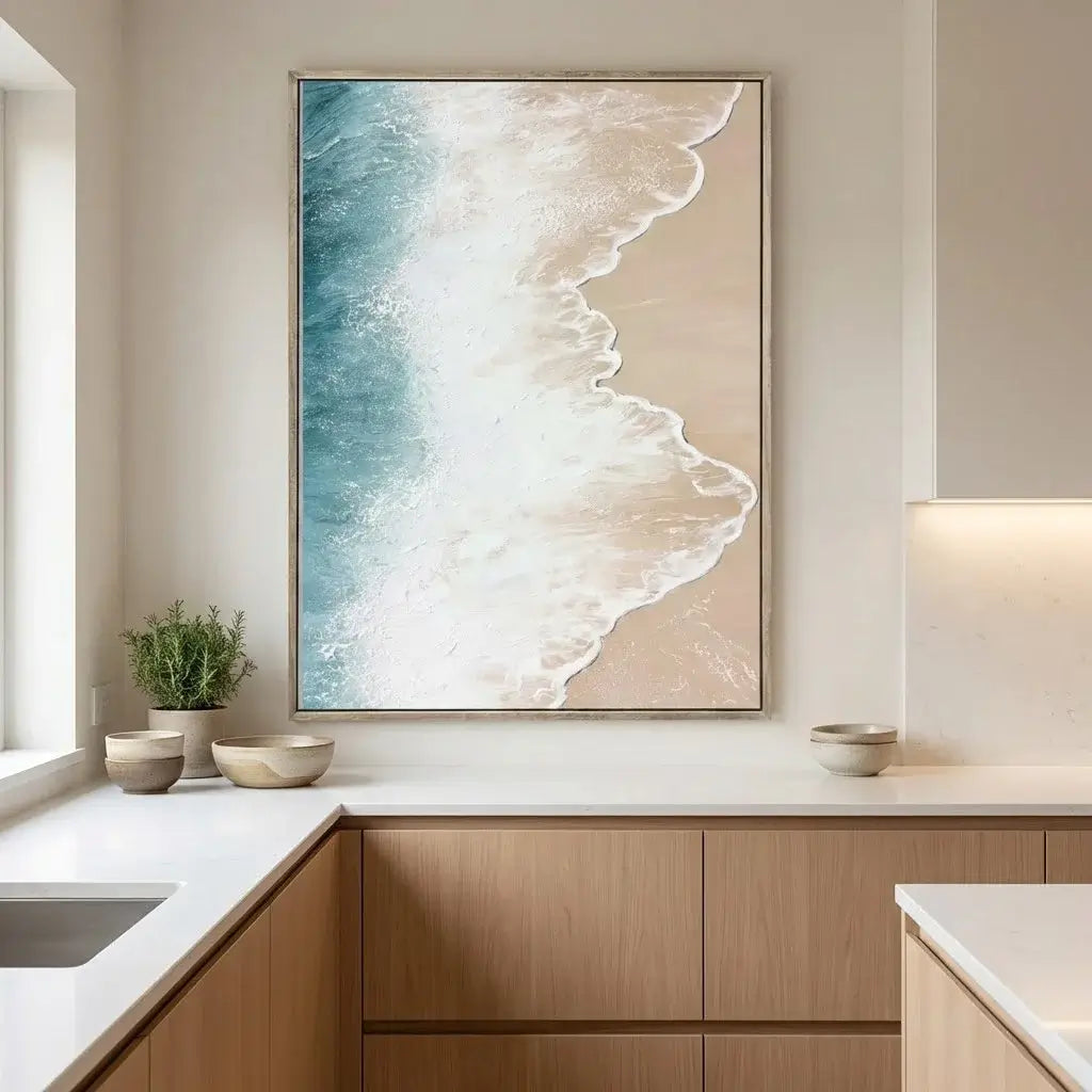 Modern kitchen with a large abstract painting of ocean waves on the wall.