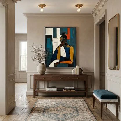Modern interior hallway with a painting, console table, and bench.