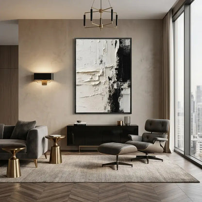 Modern living room with gray sofa, ottoman, and coffee table with abstract art on the wall.