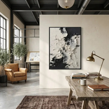 Modern interior with a wooden table, armchair, and abstract art on the wall.