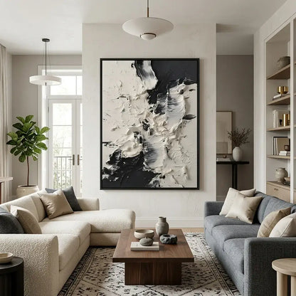 Modern living room with abstract art, comfortable seating, and decorative elements.